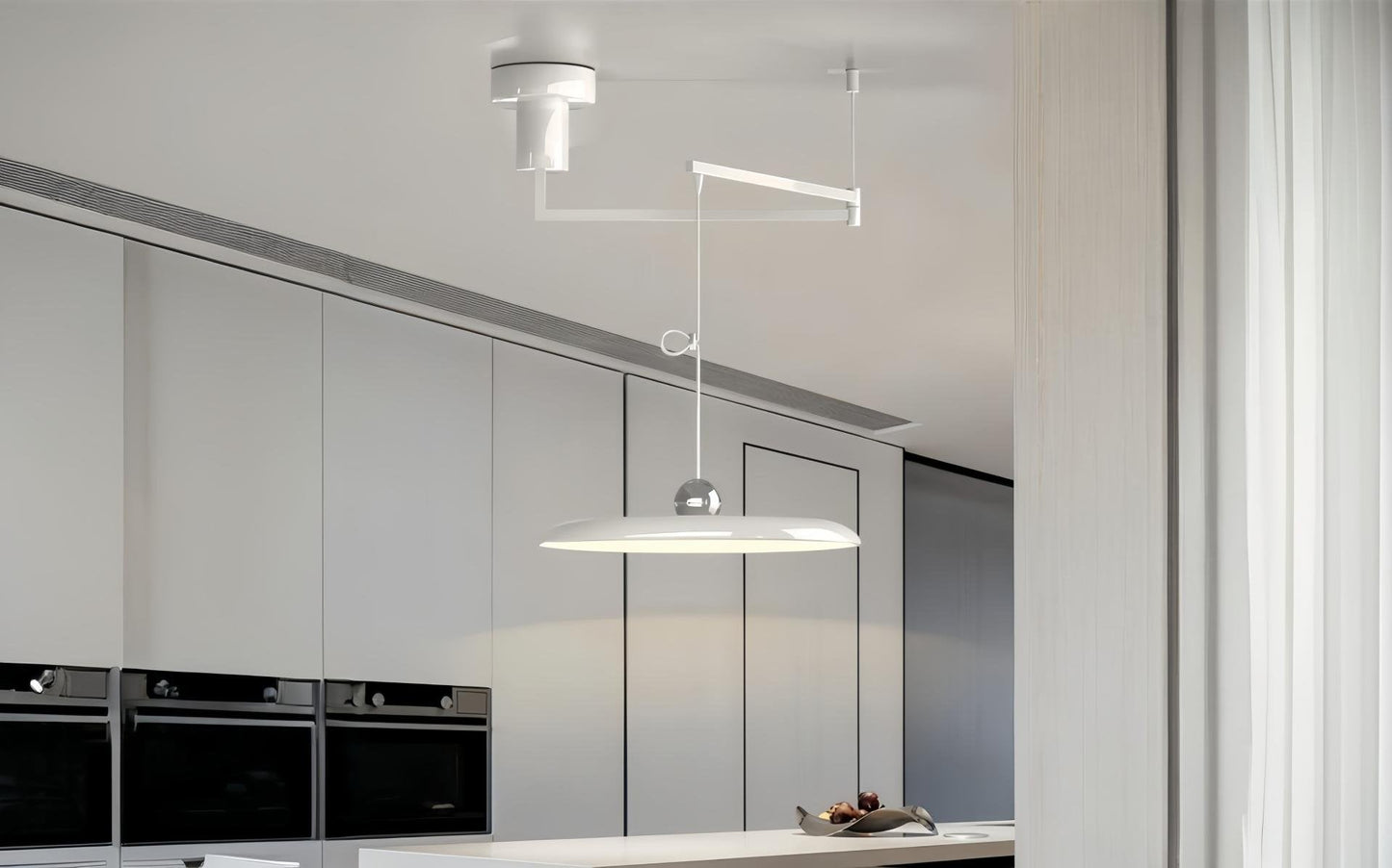 Modern pendant light with swiveling arm