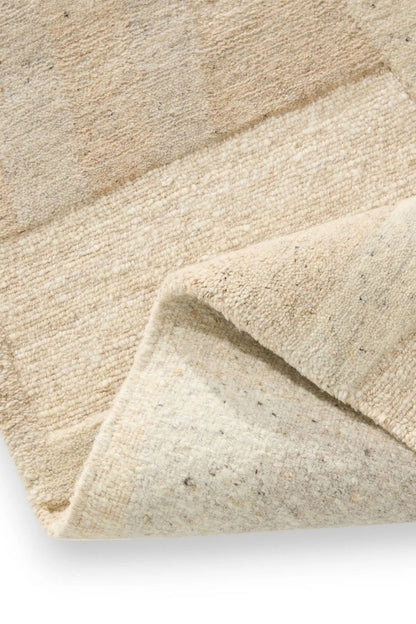 Beige hand-knotted wool rug