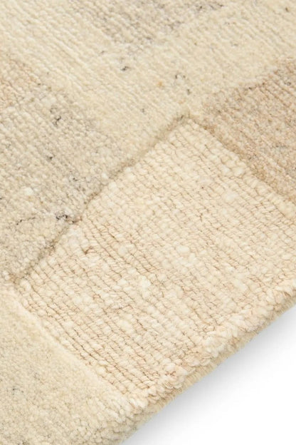 Beige hand-knotted wool rug