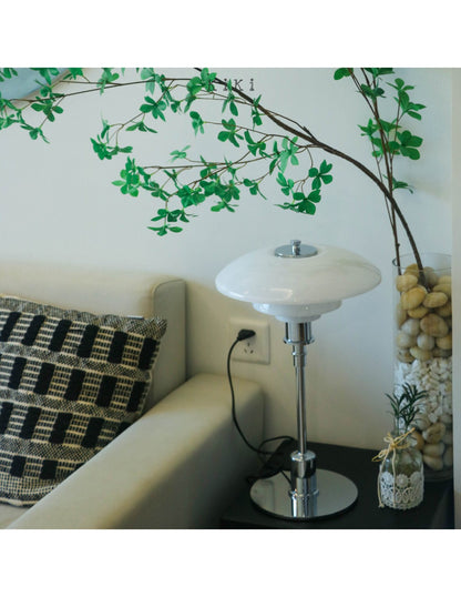 Danish metal table lamp in a disc shape