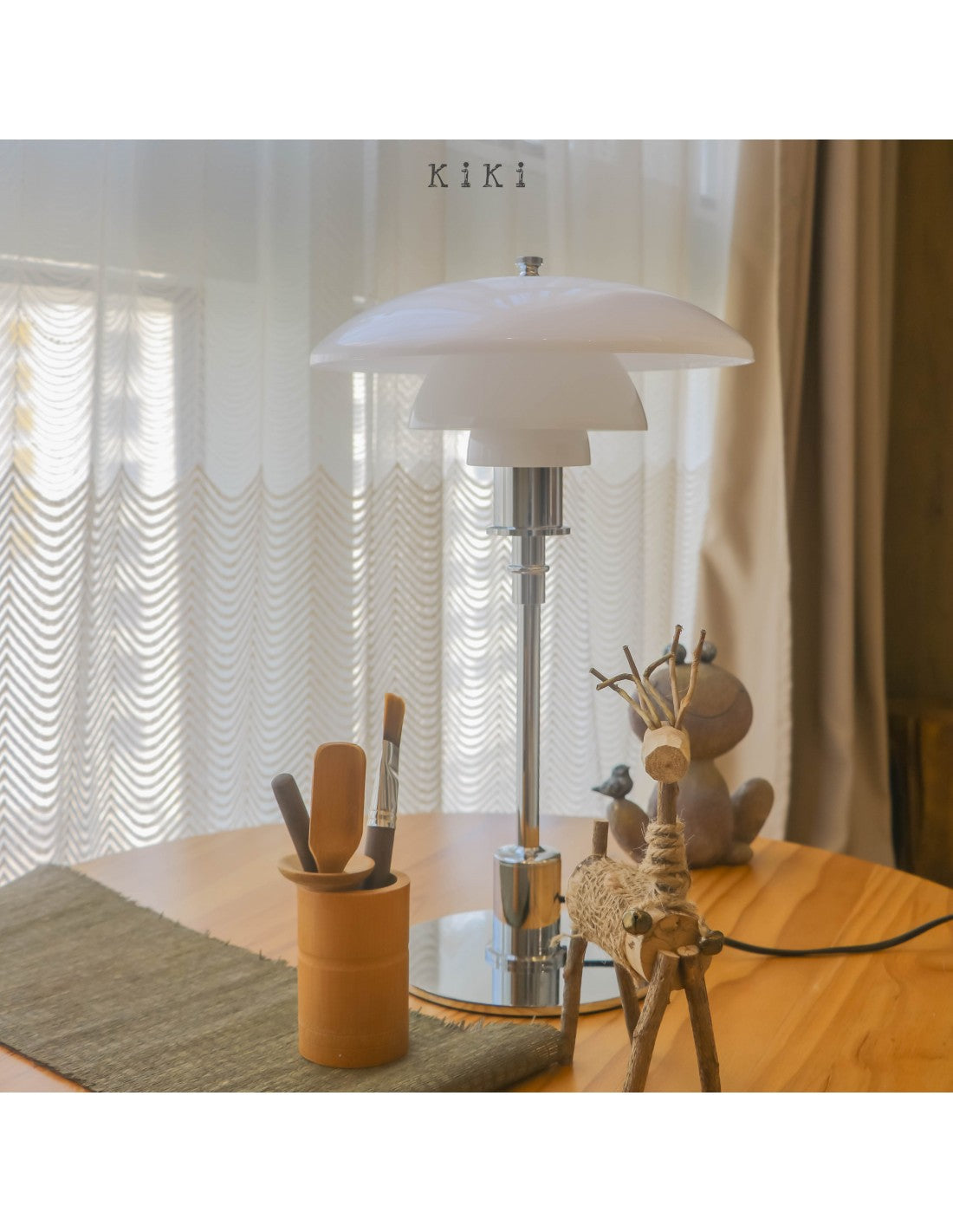 Danish metal table lamp in a disc shape