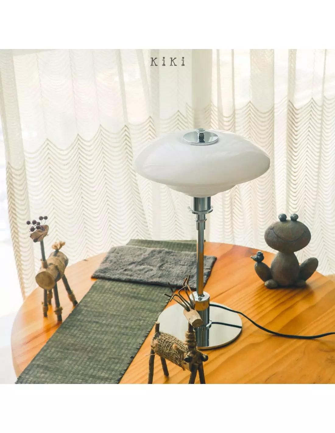 Danish metal table lamp in a disc shape