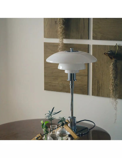 Danish metal table lamp in a disc shape